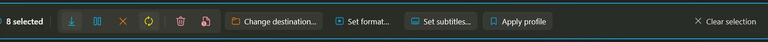 The bulk action bar reading eight selected, with download, pause, cancel, retry, remove and delete buttons and four labelled actions.